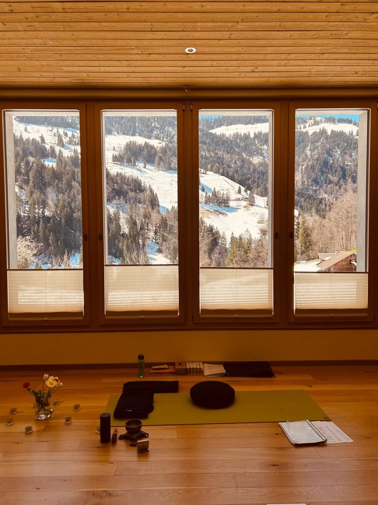 The practice room window looking out over snowy mountains